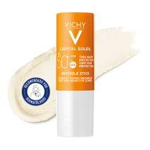 Protector solar en Stick Vichy Ideal Soleil  SPF50+ con textura de fondo y sello dermatológico