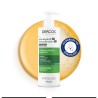 Champu Anticaspa Vichy Dercos 390ml con textura de fondo y sello dermatológico