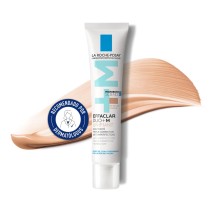 Tratamiento anti-acné Effaclar Duo (+) Unifiant Tono Medio 40ml de La Roche Posay con textura de fondo y sello dermatológico